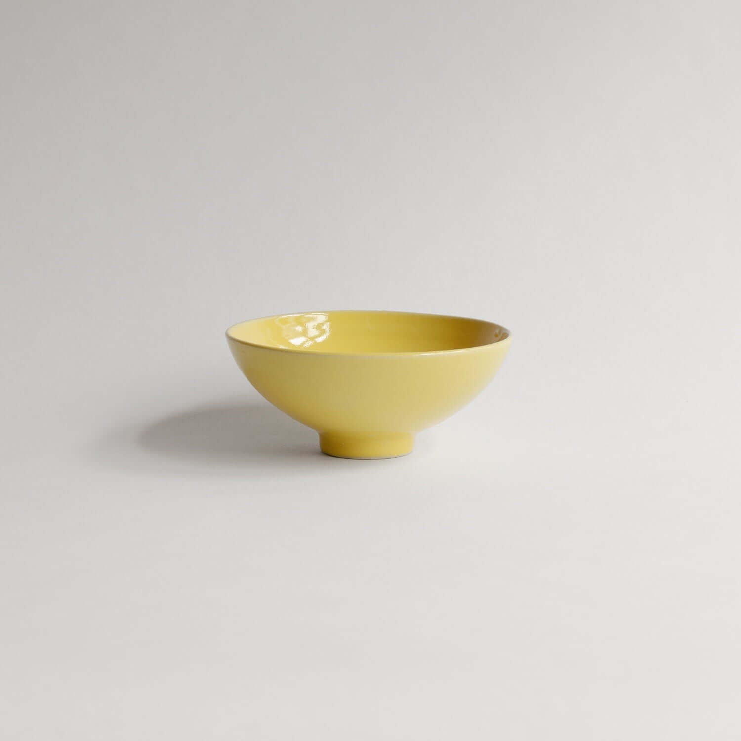Shop our unique 13cm Yellow Bowl, handcrafted from grey stoneware with a yellow glaze. Each piece is a one-of-a-kind symbol of love from our studio. von viola beuscher ceramics