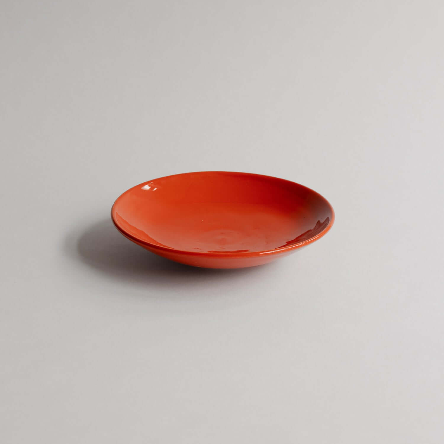 Elevate your space with the classic grey Palo Santo Dish Yun, handmade from stoneware clay and finished with a vivid red glaze. Each piece is one-of-a-kind. von viola beuscher ceramics
