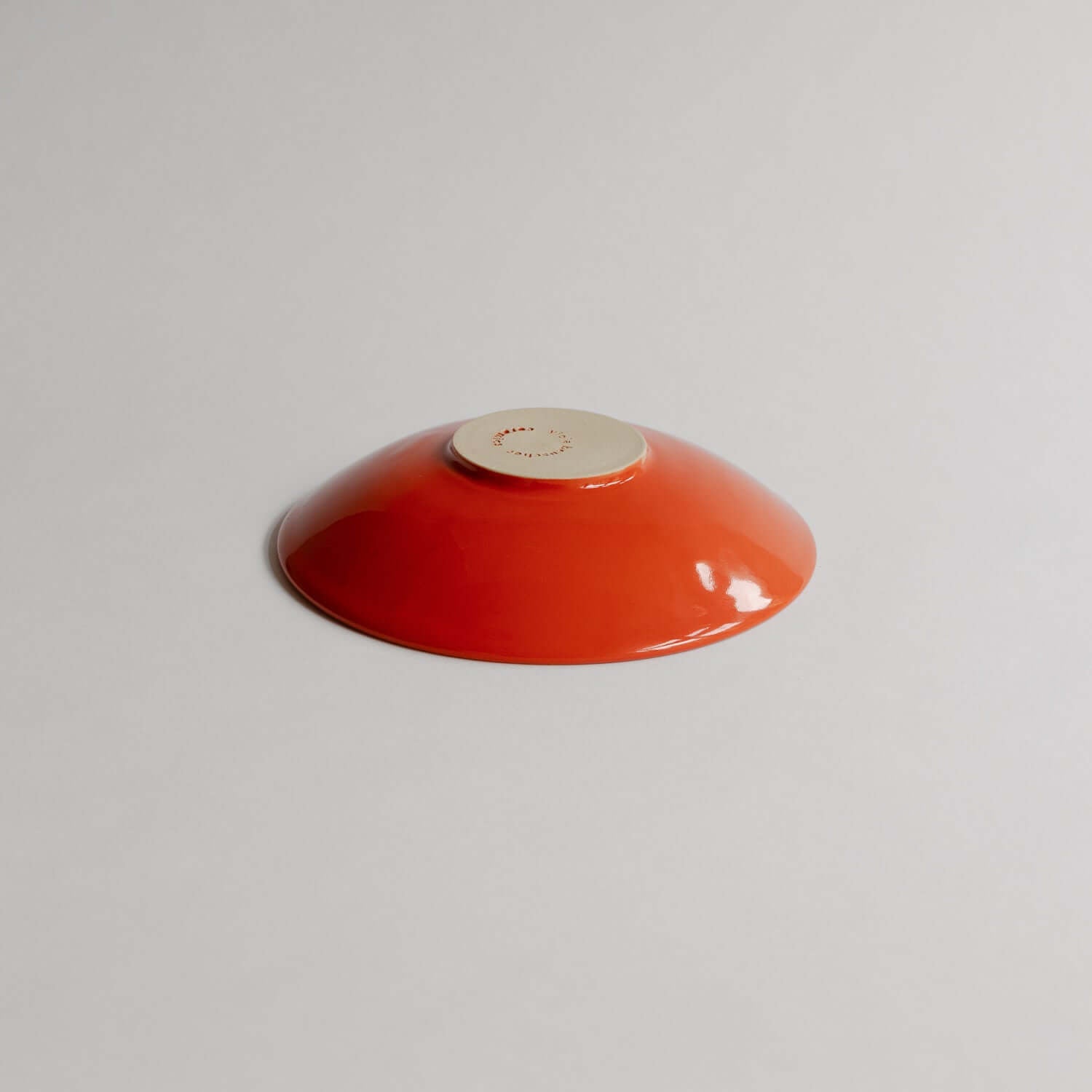 Elevate your space with the classic grey Palo Santo Dish Yun, handmade from stoneware clay and finished with a vivid red glaze. Each piece is one-of-a-kind. von viola beuscher ceramics