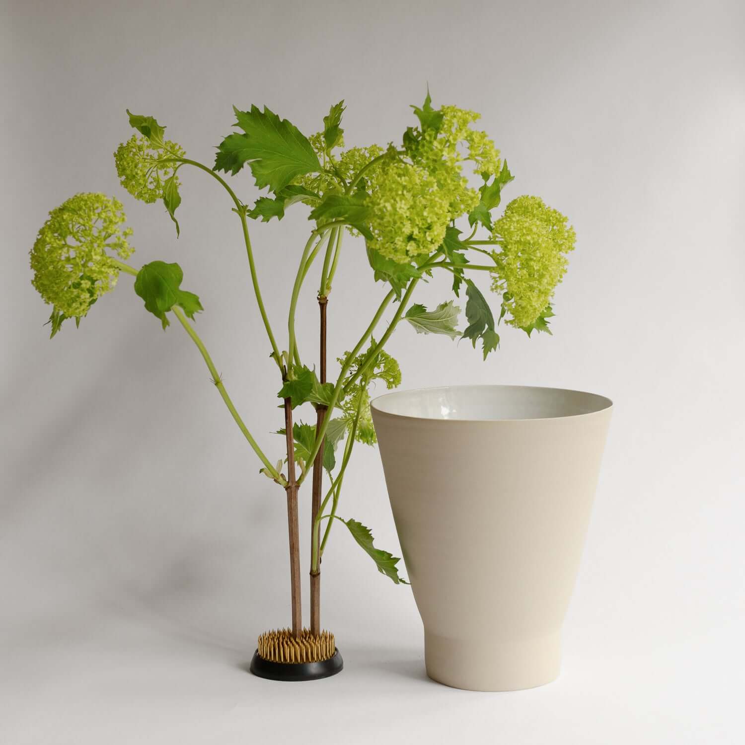 Elevate your decor with the unique Tuva Green Vase. Artisanal grey stoneware with food-safe glazes. Embrace handmade beauty. von viola beuscher ceramics